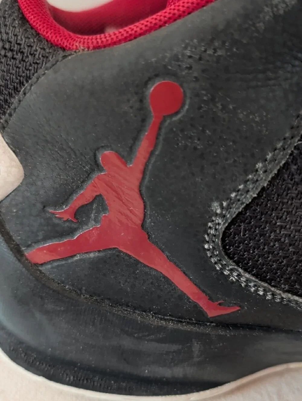 Jordan Men’s Black and Red High-Top Athletic Basketball Shoes.